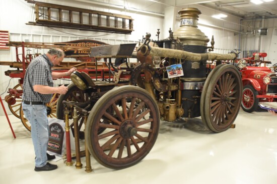 The 1902 American Metropolitan Steamer was pulled by three horses and carried a steam engine water pump.