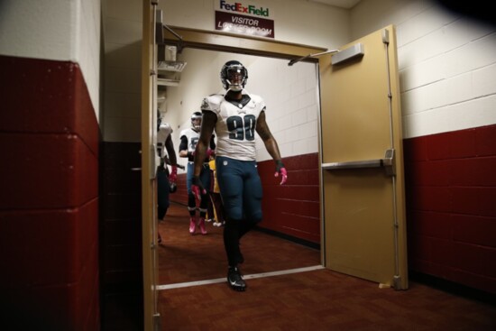 Marcus leads his teammates out to the field. 