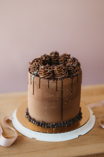 Iced to perfection, this 3-layer chocolate cake will make your mouth water. Photo by Marie Claire Photography.