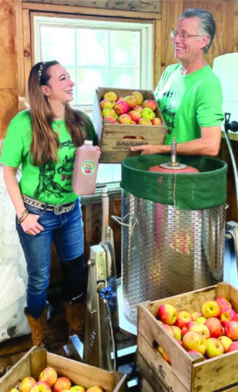 Owners Ben and Gaile with their apple press