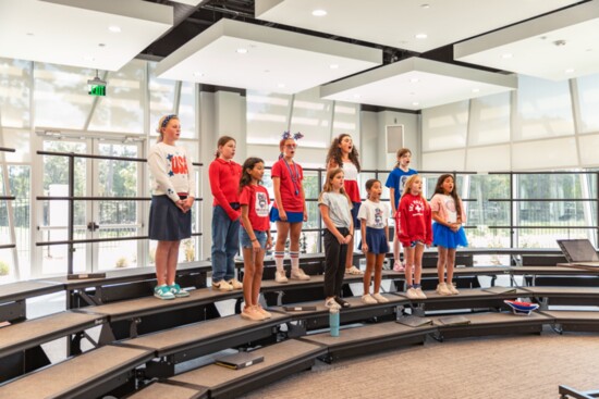 Middle School choir students prepare for a concert.