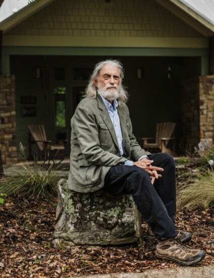 Dave Boeck strikes a pensive pose outside his Norman home, which he designed himself.
