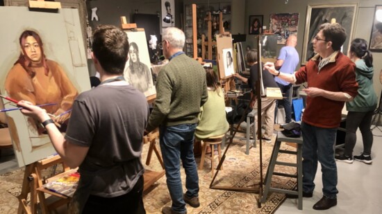 Students drawing and painting from a live model at the Diana K. Gibson Fine Art Studio.