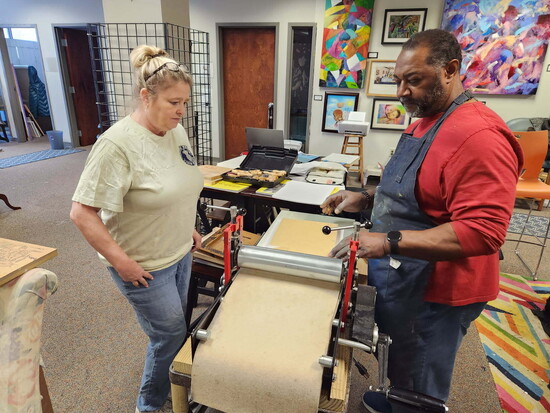 Arts Bellevue board member Jeanne Fain (left) and Michael McBride