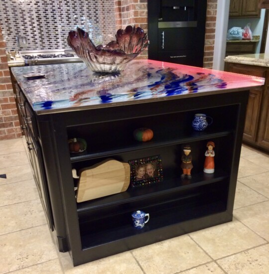 This beautiful glass countertop may be considered a work of art. This one graces a kitchen in a home in Edmond. (Photo by Denise Huff)