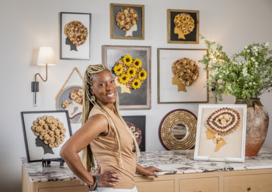Havana-born artist, Isabel Lemus, with several of her Caribbean-inspired "AphroVines" made with recycled corks.  @corkdivine on Instagram.