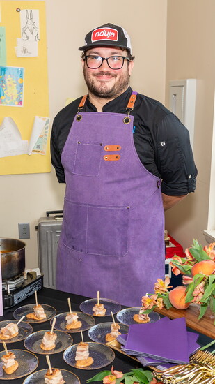A Nossi student displays samples of a special recipe.