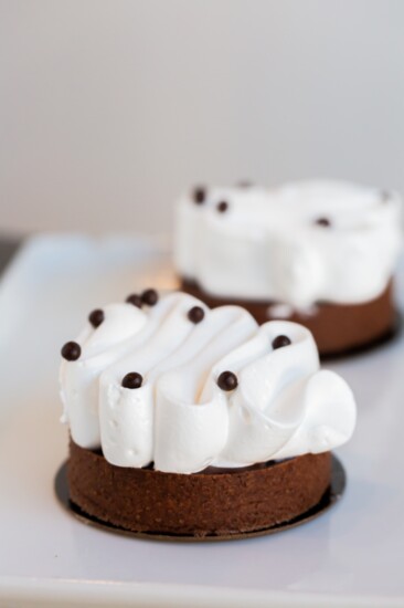 Fresh banana filled chocolate tart With meringue on top. 