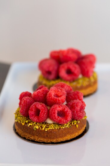 Pistachio Raspberry tart filled vanilla crème patisserie. 