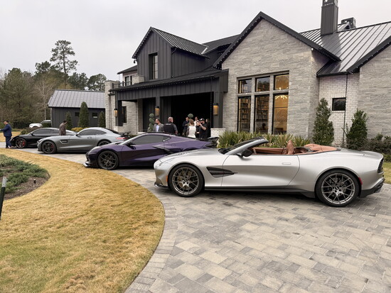 The Aston Martin Vanquish rightly sitting in Pride of Place at an open house.