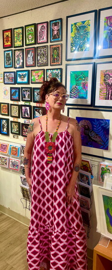 Sigrid Eilertson with her artwork. Photo courtesy of Sigrid Eilertson. 