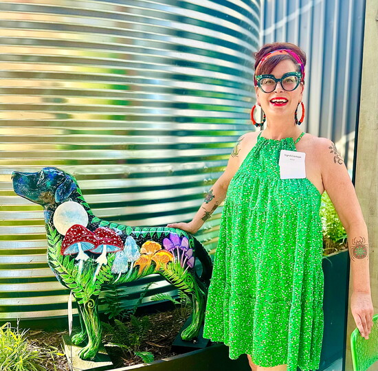 Sigrid Eilertson with her painted service dog sculpture. Photo courtesy of Sigrid Eilertson. 