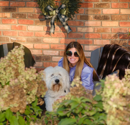 Heather and her dog, Wickford, who happily tags along on farm runs