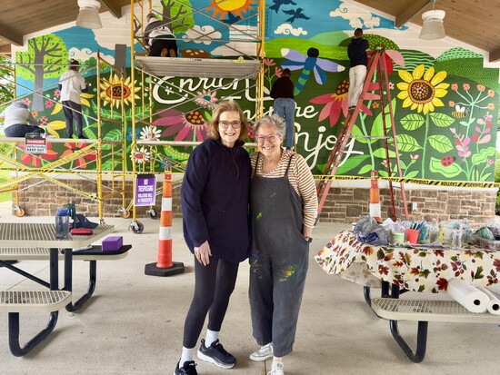 Meredith Raffel and Laurie Siebert alongside the in-progress mural. Deerfield Twp. generously covered Laurie’s fee for the project. 
