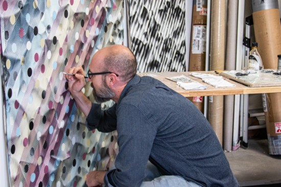 Michael Anthony Simon working in his studio at Artworks Loveland
