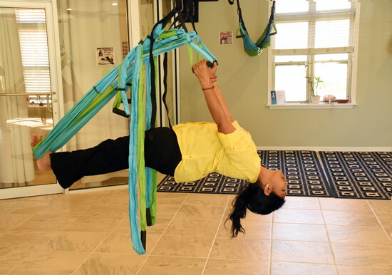 Enjoy the therapeutic practice of Aerial Yoga at the Therapeutic Medical Massage studio.