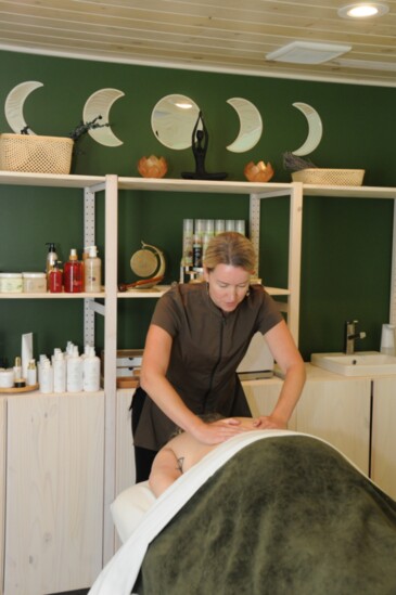 A masseuse at work inside the new Asana Organic Skin & Beauty.