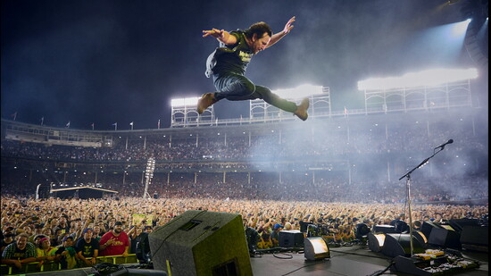 Pearl Jam's Eddie Vedder leaping for a fly ball at his beloved Wrigley Field