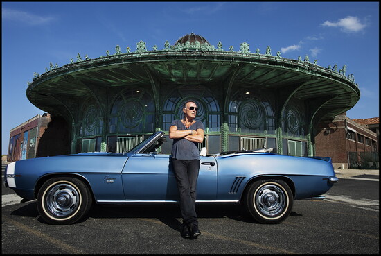 The Boss hanging out in Asbury Park in front of a car that's not a pink Cadillac
