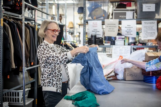 A member of the Assistance League of Atlanta sorts through items. 