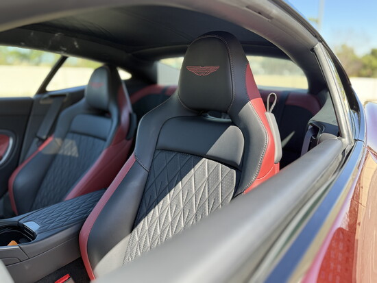 Hand-stitched Bridge of Weir leather and ergonomic design create a luxurious, driver-focused cockpit tailored for modern grand touring.