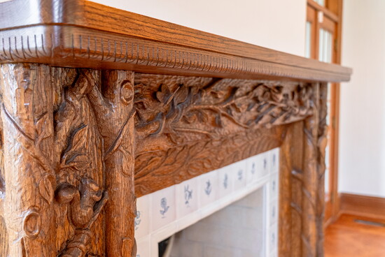 The one-of-a-kind, hand-carved mantelpiece in the living room is a seek-and-find of woodland creatures indigenous to Indian Hill.
