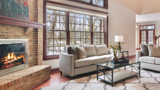 Great room with fireplace and view of the pond.