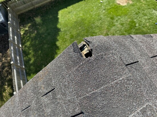 Missing shingle on roof corner