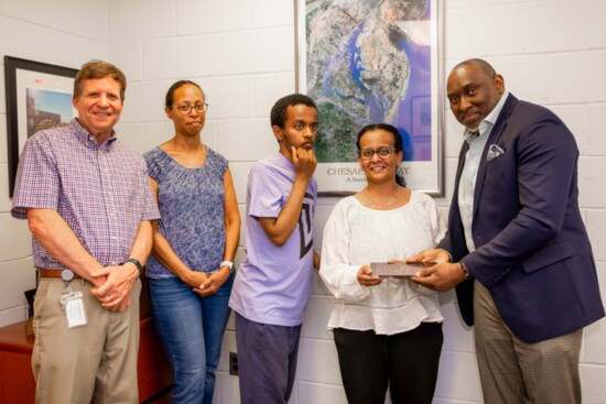 Ike Ogbuebile presenting an Adaptive Tablet to a family at Cedar Lane School, Fulton MD as part of AAG’s Adaptive Technology program