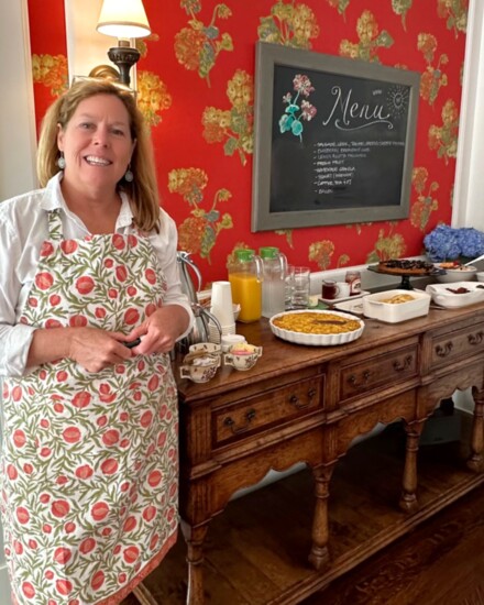 Innkeeper Sarah Cooper prepares to serve breakfast to guests