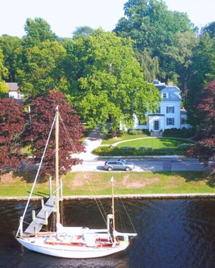 A sailboat gently moored at the Inn’s dock, ready for a serene river escape