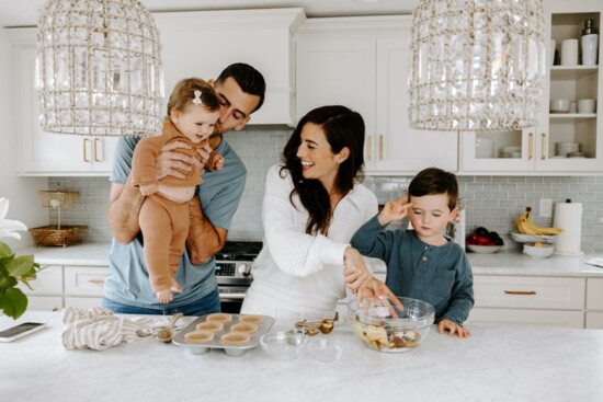 Author Sarah Adler cooking with her family