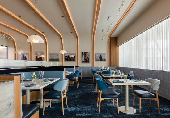 An abundance of windows and natural light help to create an open, modern aesthetic.