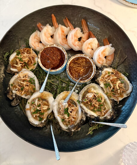 Pacific Northwest oysters and size U-8 “colossal” shrimp comprise the roasted oyster and shrimp cocktail platter.