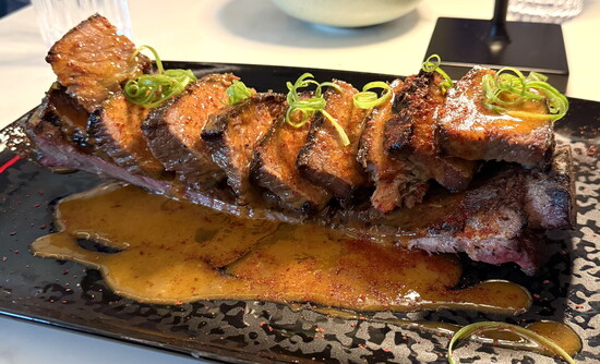 The ember-roasted beef “big rib.”