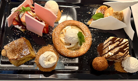 Sweet endings: apple tart (center), bread putting, strawberry shortcake, “Momma Bear’s” banana pudding, and s’mores (clockwise, from bottom left).