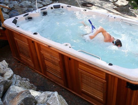 FOR YOUR HEALTH Adding a hot tub or all-weather pool, which is a larger spa that can be used for water exercises, is a healthy addition to any outdoor space. 