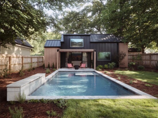 Dappled sunlight moves through the yard, creating a serene retreat around the pool.