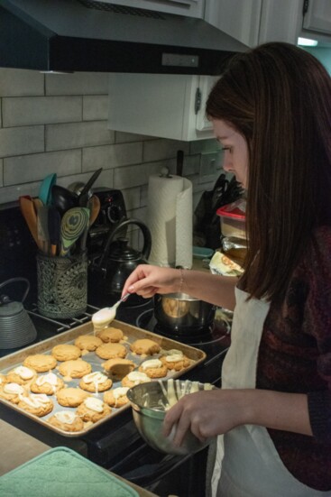 Kiera Chapmon decorating her Maple Cookies