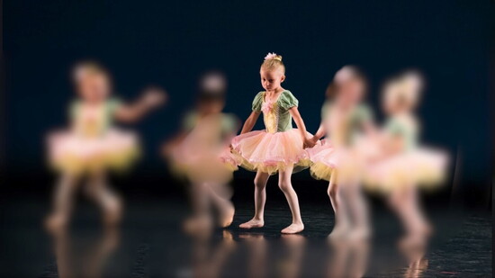Our cover girl, Emma, as a shy ballerina during her first performance