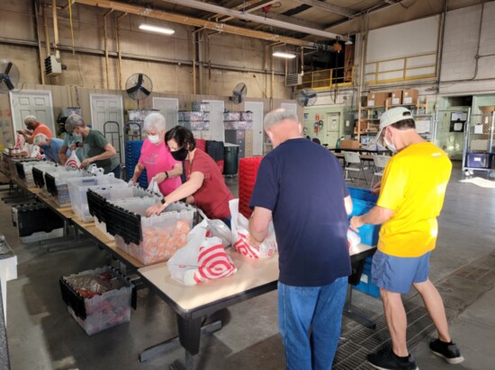 Bright Futures Volunteers Weekly Pack Food Bags for Needy Students