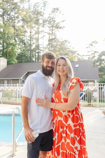 John McFall with FullTilt Lanscapes, shared a sweet embrace with his wife, Anne Marie McFall with Hygge Homes Team.