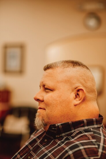 John Schriner, Business Solutions Advisor for ADT, receives a flat top. (Stylist - Kevin Fogg)