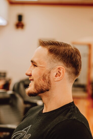 Steve Sparks, certified personal trainer and owner of Just Livin' Clothing Co., LLC, receives a low skin drop fade. (Stylist - Tyler Tribby)
