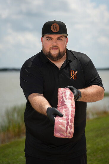 Patrick Lynch, Owner with a rack of ribs