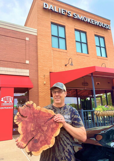 Craig serves his homemade sausages and charcuterie on hand-cut pieces of wood.