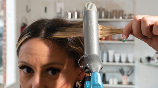 Run a curling iron down the section to prepare it for the curl.
