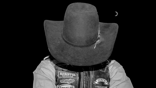Title: "The Midnight Rider" gathers himself before bull riding at the Bit ‘n’ Spur Rodeo in Tooele, Utah (2025)