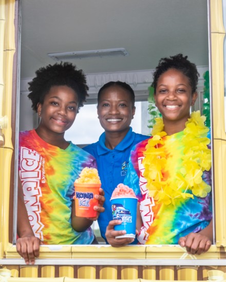 Jamesa Hill with daughters Avani and Jayla holding some delicious shaved ice treats.