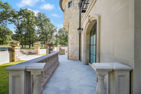 Renaissance Cast Stone also completed much of the work on this beautiful Oklahoma City home. Shown here: an intimate porch with classic ballistrades.